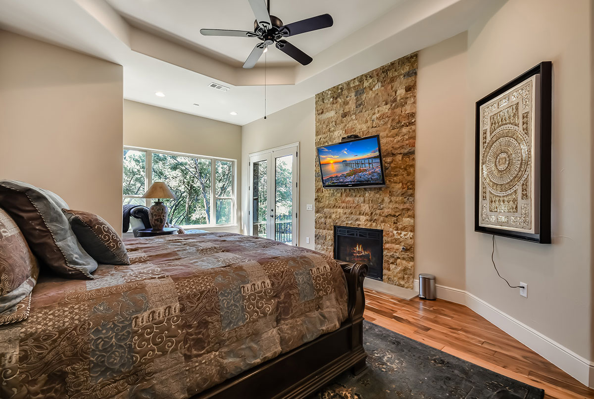 beautiful master bedroom with outdoor access and a view